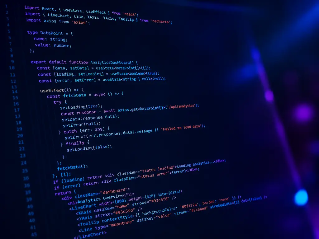 Software code displayed against deep blue and violet light